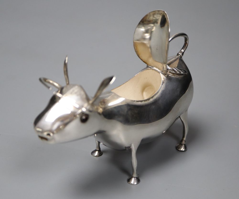 A mid 20th century Dutch white metal cow creamer, length 14cm, gross 145 grams.